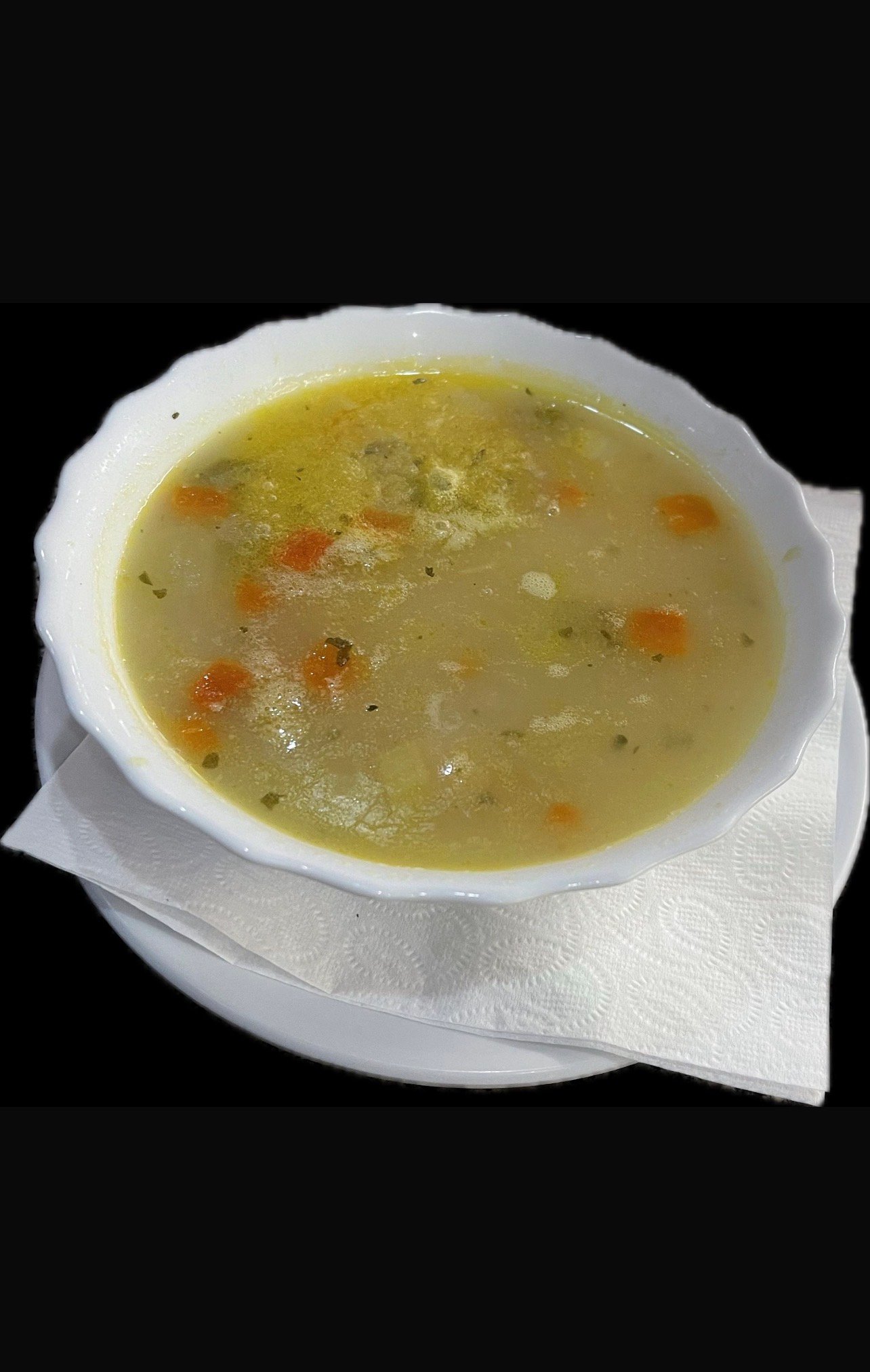 Pikante Hühnersuppe mit Brot